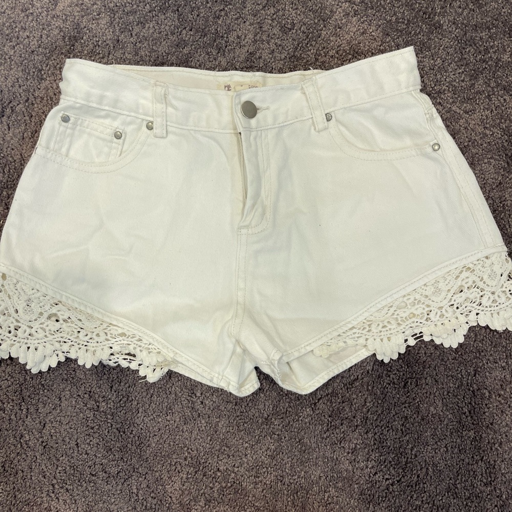 White denim shorts - floral crochet detail